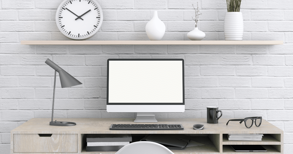 Minimalist desk setup with a clock and notepad, symbolizing time management.